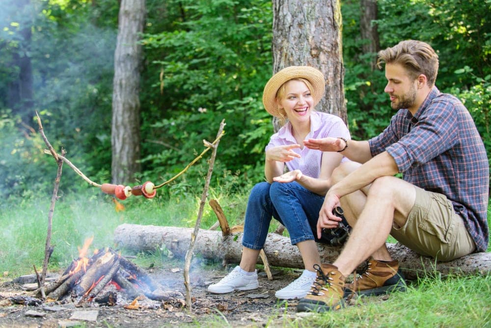 Couple having fun while camping