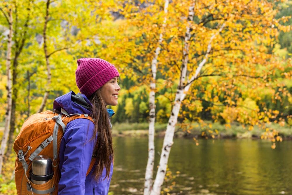 Woman hiker looking at scenic view of fall