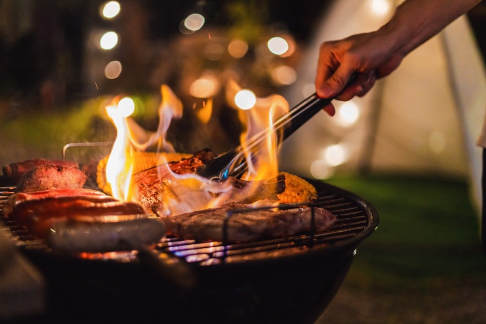 Grilling outdoors with barbecue