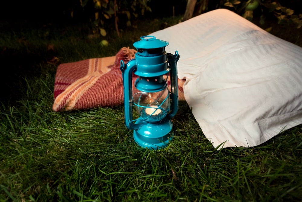 Pillow and a camping lanter on the ground
