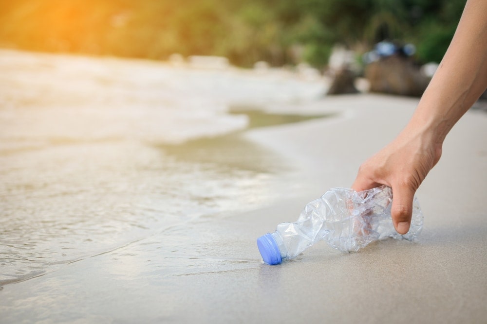 Holding a used water bottle
