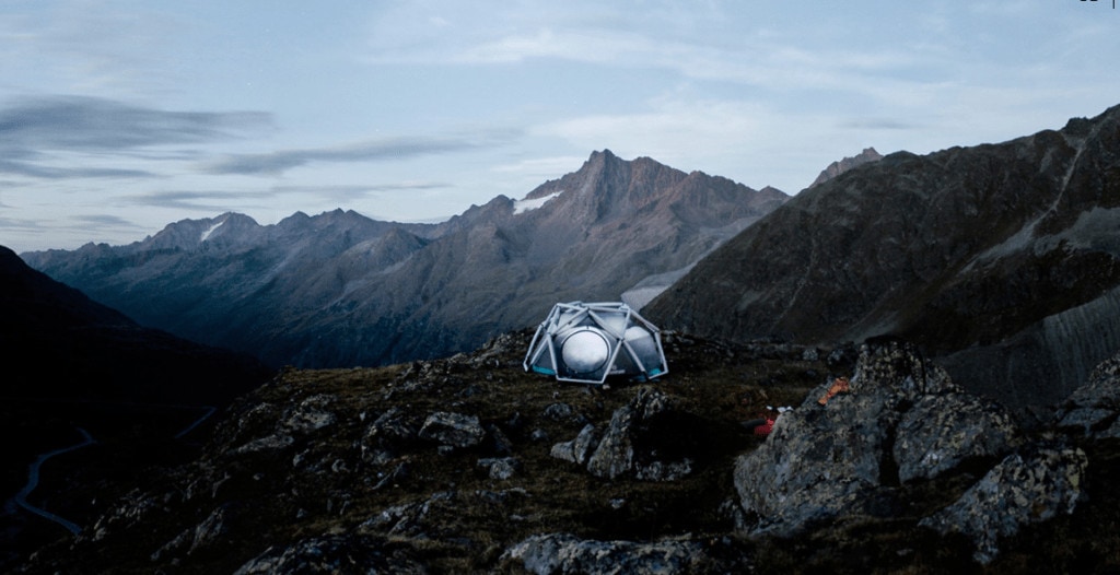 image of a geodesic tent in the mountains