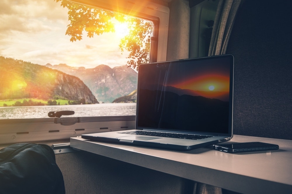 Laptop inside a RV with outdoor view