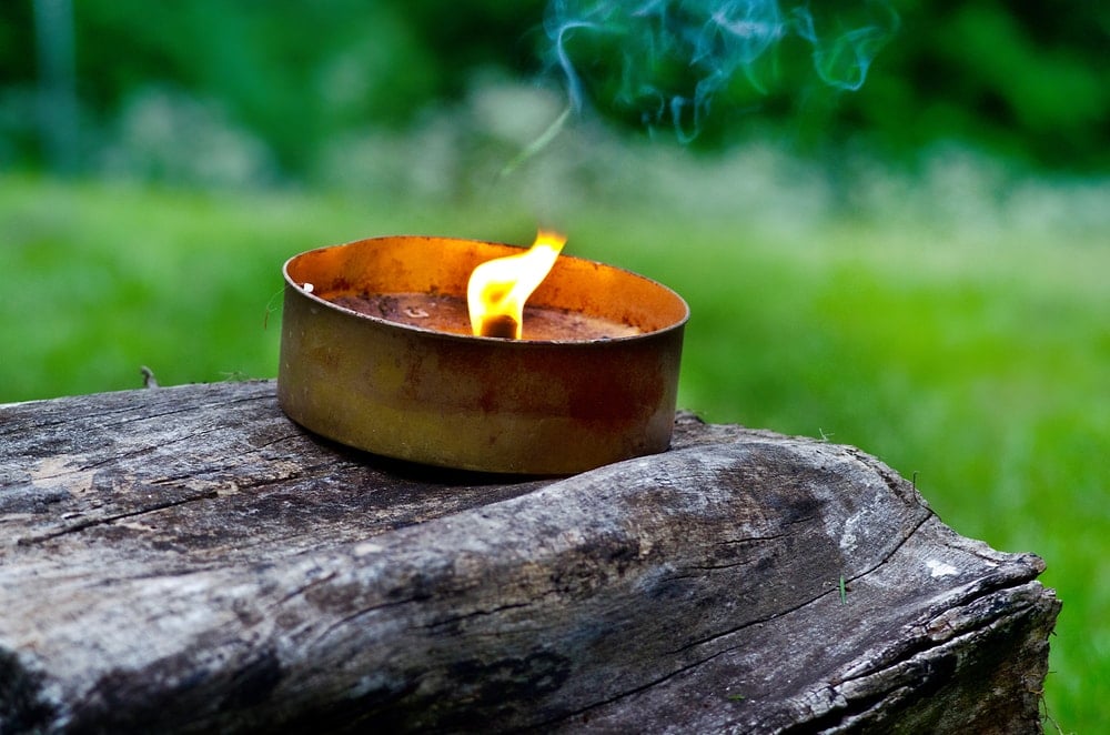 Candle on tin can