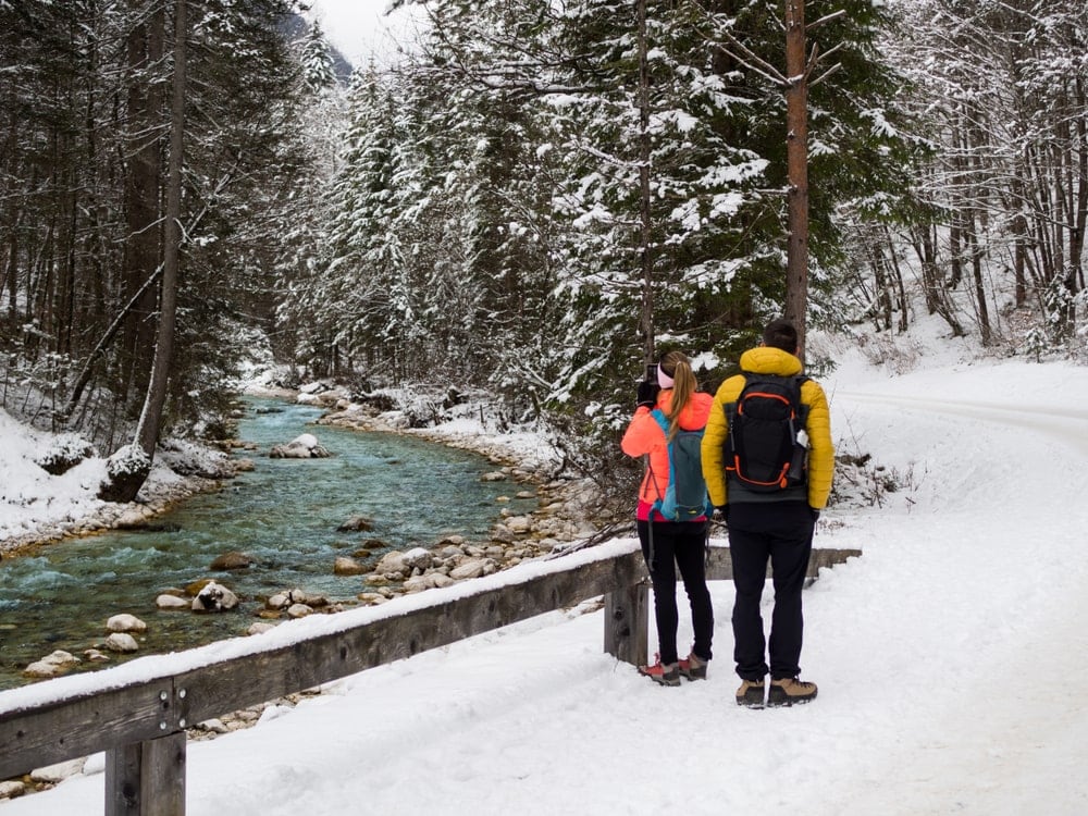 Hikers taking a picture of a river