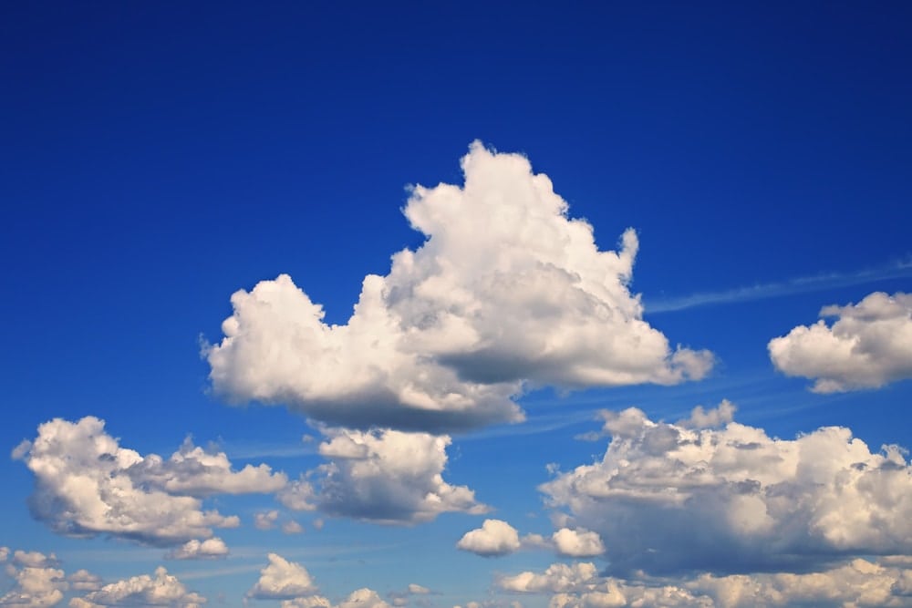 Blue sky with fluffy cumulus clouds
