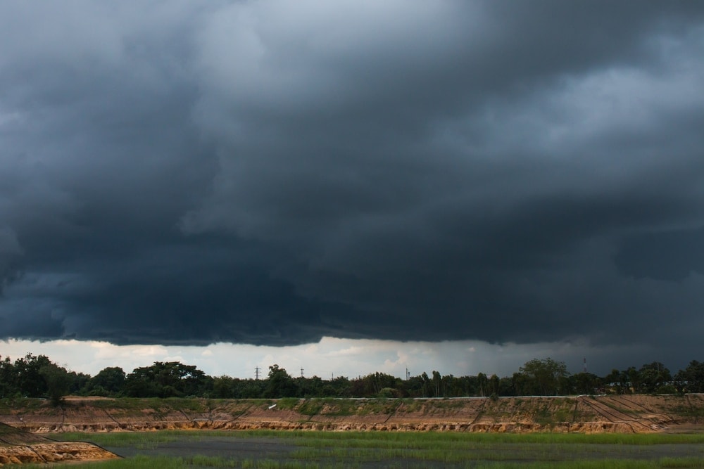 Dark grey clouds aka nimbostratus clouds above a countryside
