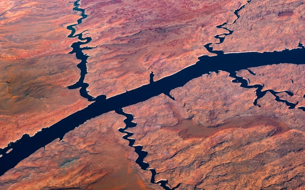 Aerial view of a river and tributary rivers flowing across a desert