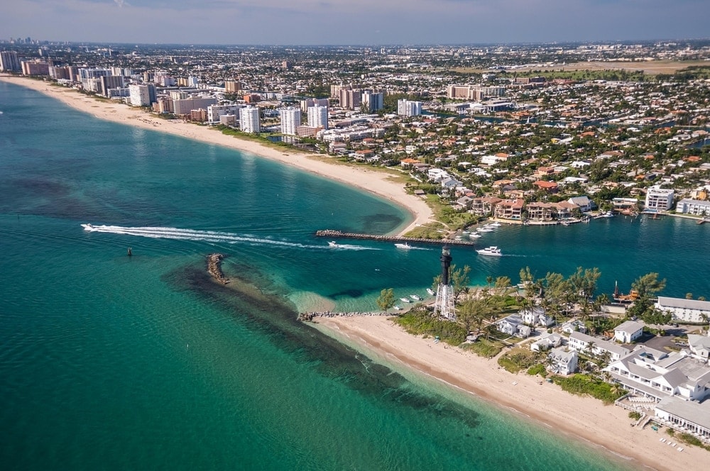 Aerial view of beach and boaters at Hillsboro inlet in florida