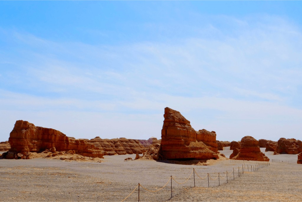 Yardang landform under sunny blue sky in China.