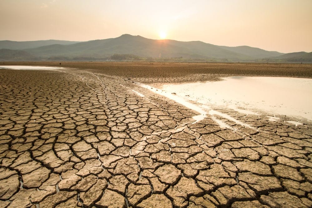 Drying lake on a sunny day caused by drought, a type of natural disasters
