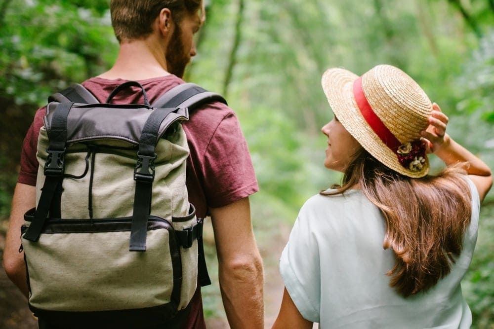 Couple looking at each other while on a hiking date