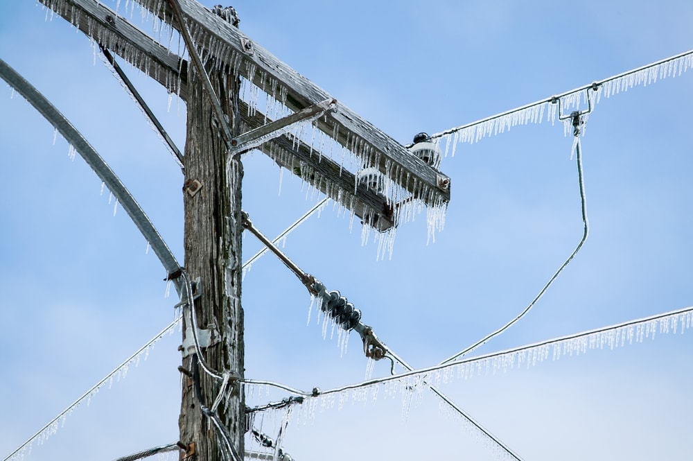 Power line covered by frozen ice from ice storms