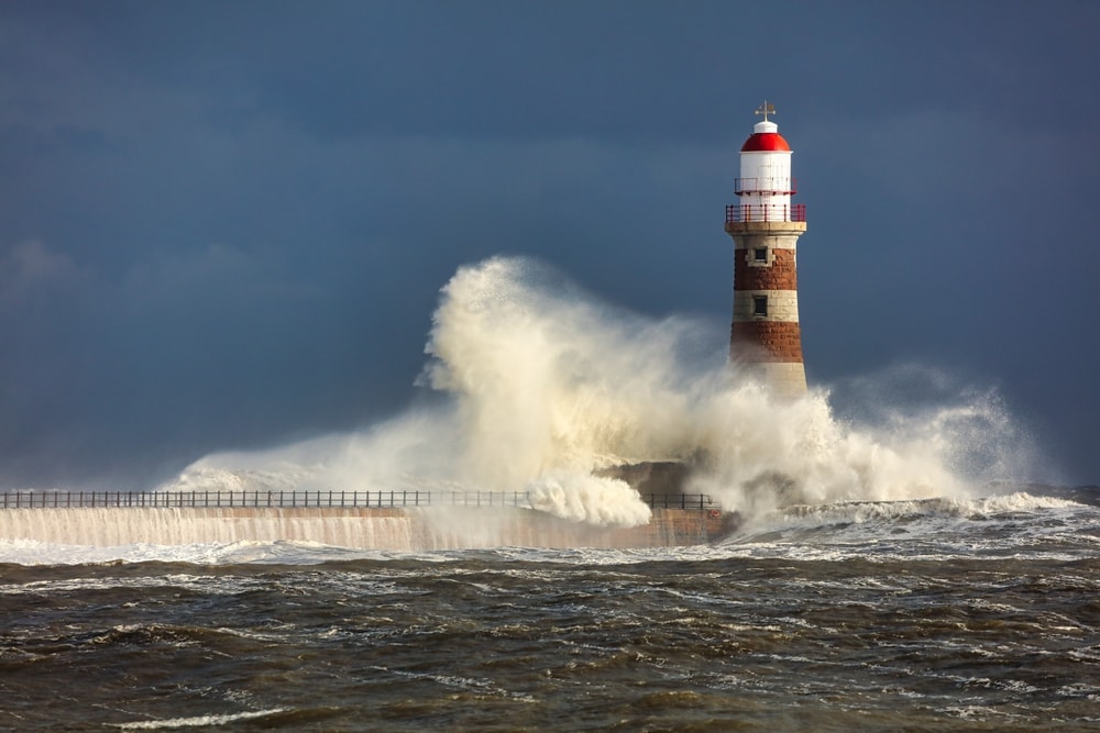 Big waves and lighthouse during a storm