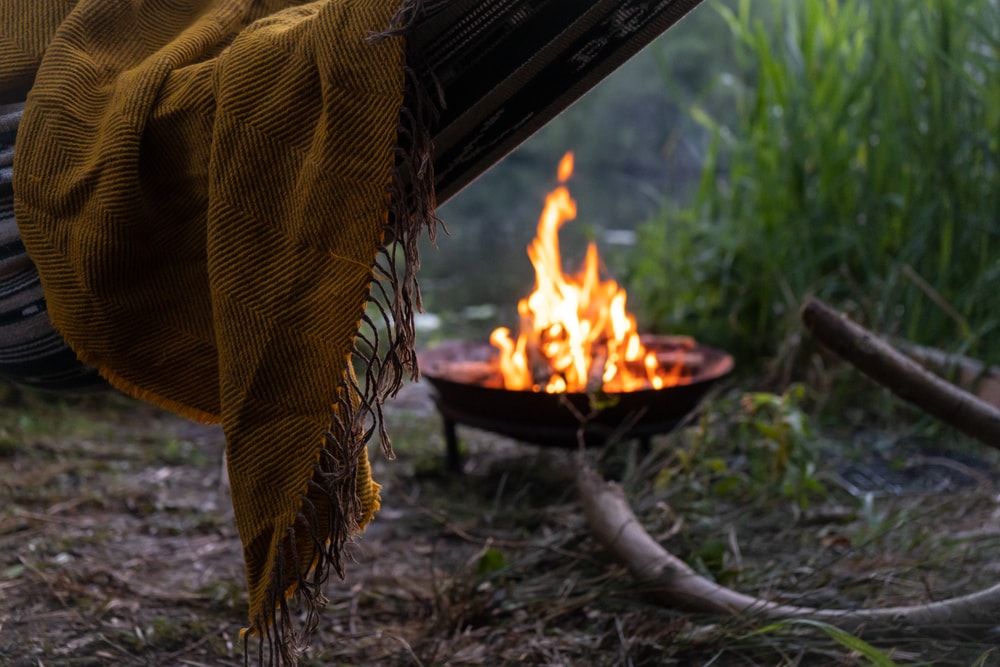 Cotton blanket on the hammock next to firepit