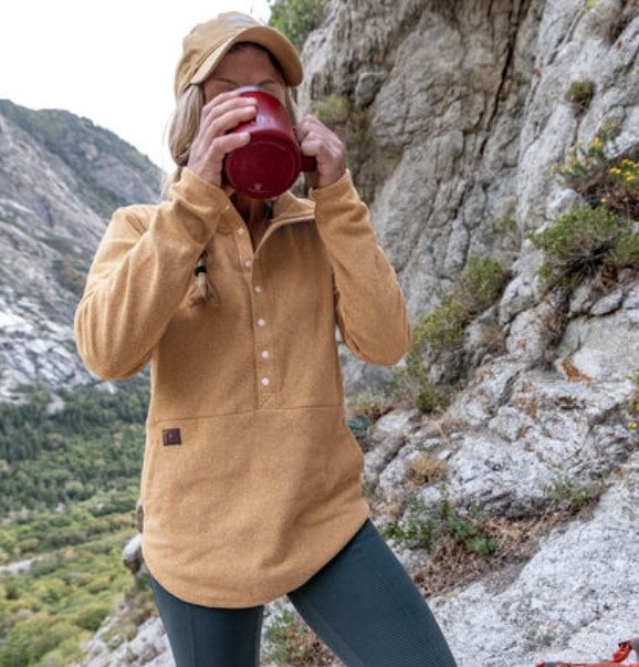 Female Hiker wearing a title nine sweater
