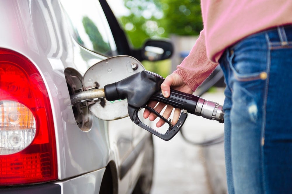 a person refuelling a car