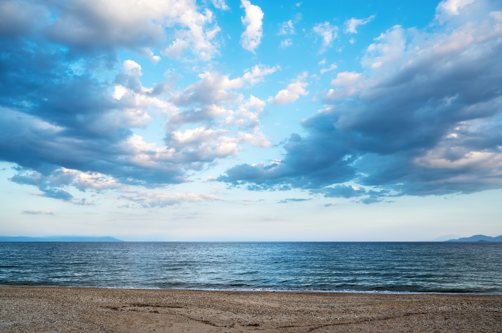A beach landscape during a partly cloudy weather