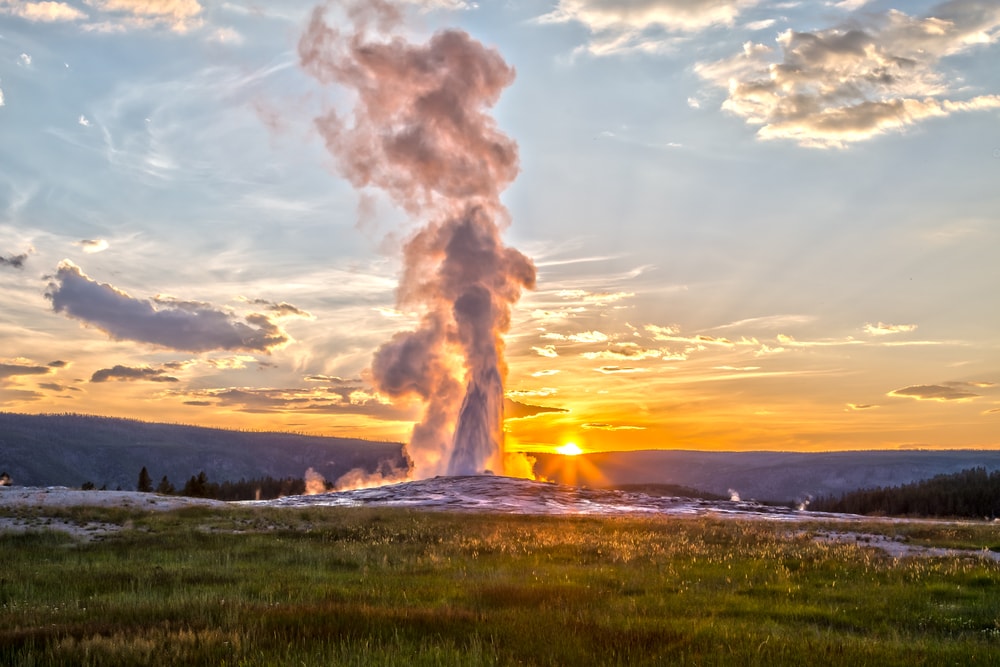 steam coming from Old Faithful geyser in Yellowstone National Park