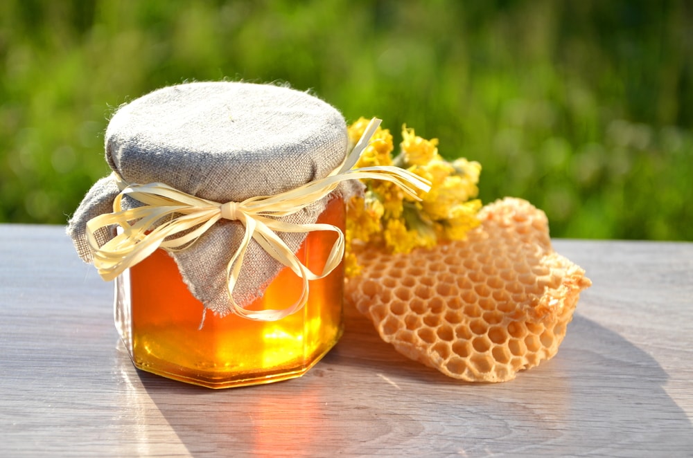 Honey and honeycomb on the table