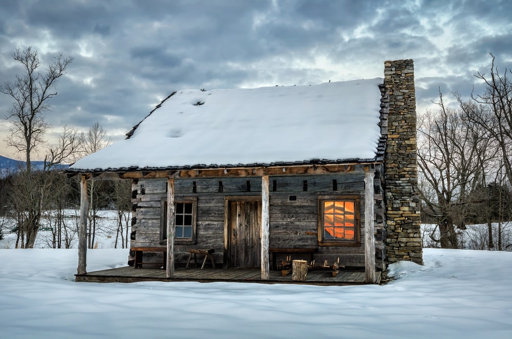 Wooden shelter in the middle of snow