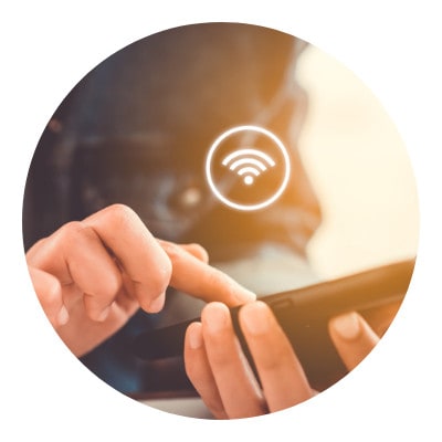 A person scrolling on her phone with WiFi icon on it
