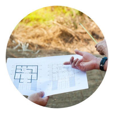 Three people choosing their land for shelter