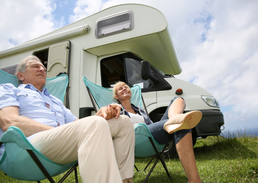 2 elder people enjoying the fresh air RV Camping style
