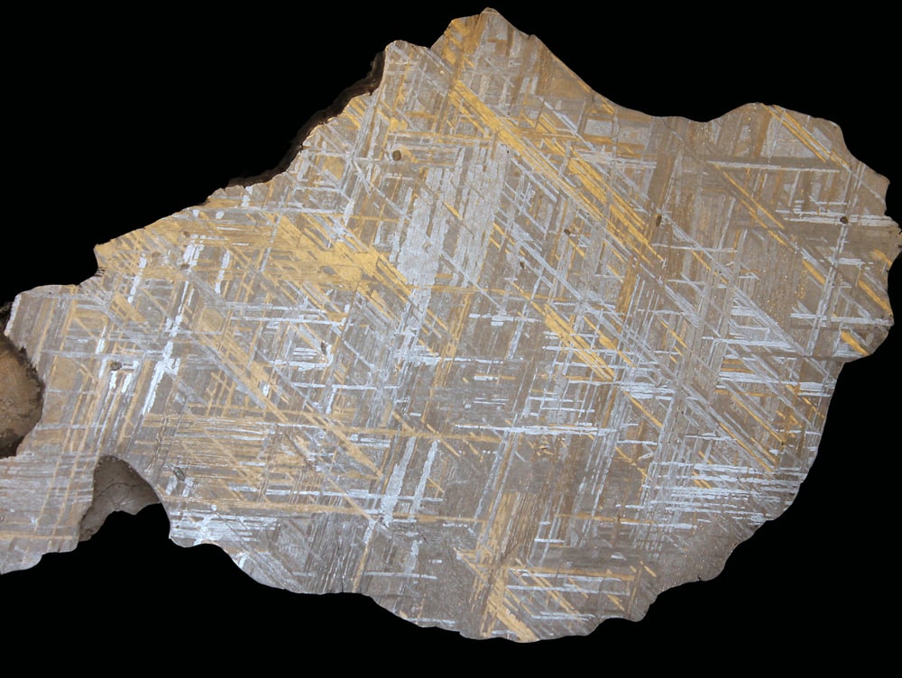 a polished crystalized iron meteorite showing the Widmanstatten pattern