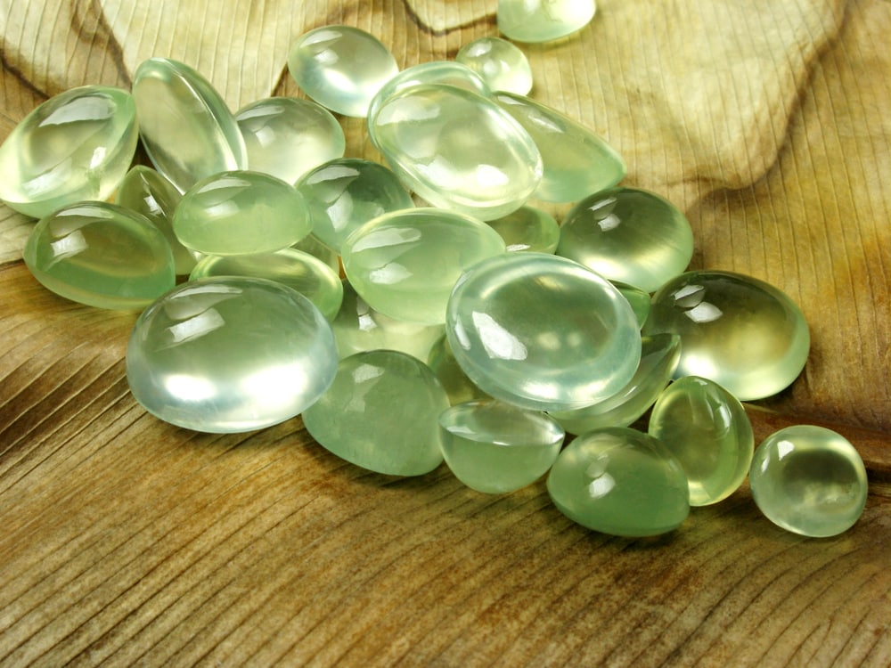 green Prehnite precious gemstone cut in a cabochon shape 