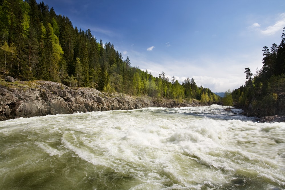 A fast moving river with white water rapids.