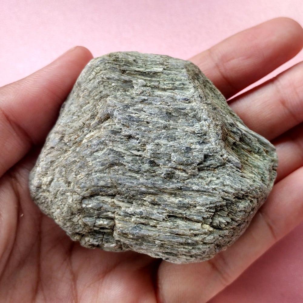 Greenschist, Metamorphic Rocks example, holding by a man