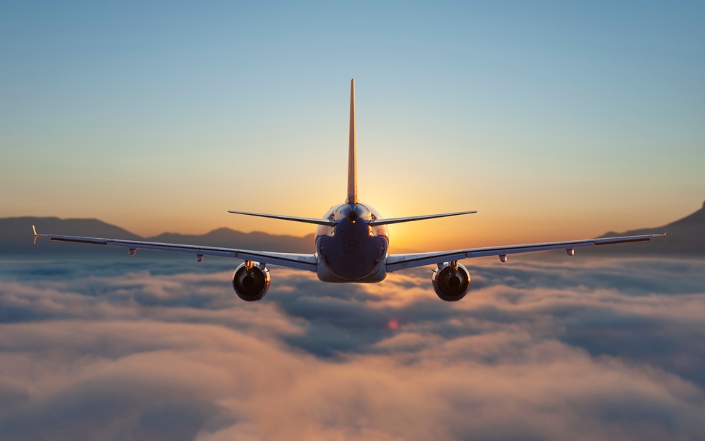 Plane flying above the clouds
