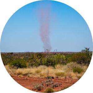 a landspout forming on a desert