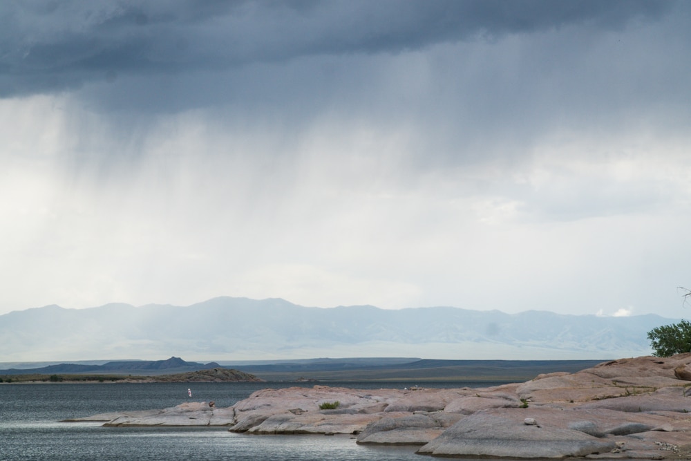 Virga clouds ready to form above lake