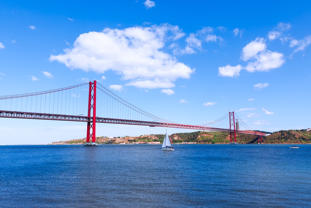 San Francisco Bay with boat sailing to the bridge