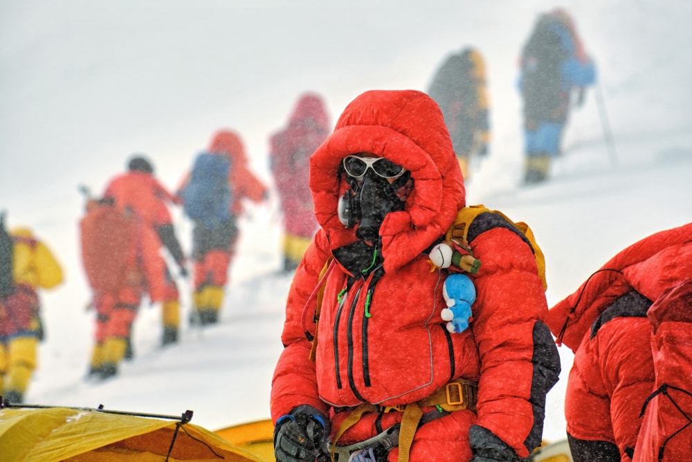 a climber wearing an oxygen mask in the Himalayan mountains 