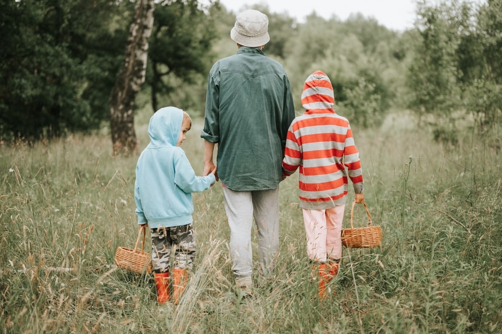 Family leaving the forest after foraging