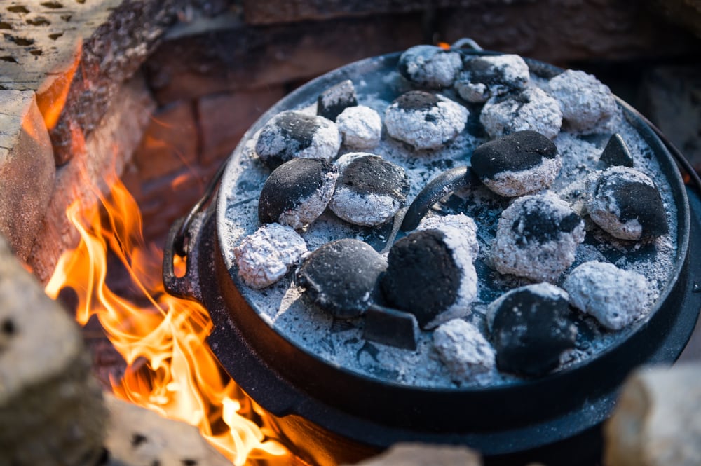 Stones on top of a lid inside a pit of