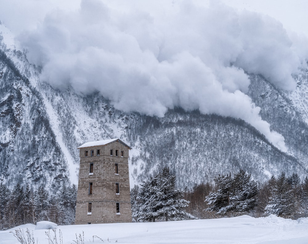avalanche falling to the foot of the mountain