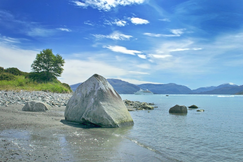 Chilean fjords with a huge stone on the shore