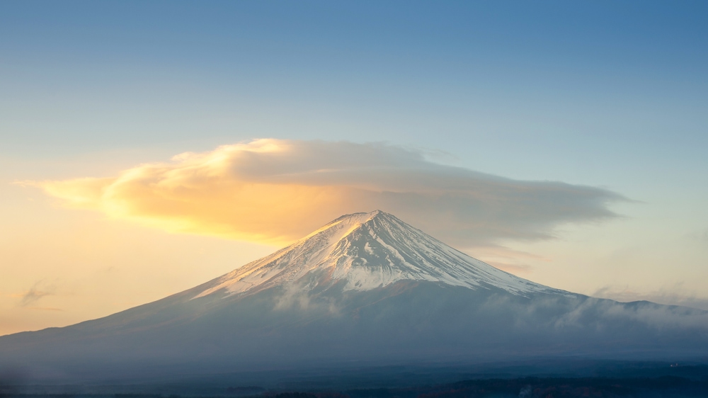 Altostratus clouds on the tip of a snow mountain