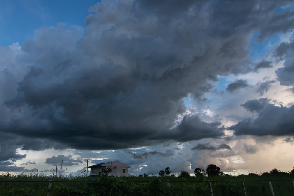 Nimbostratus clouds formed on top of a house
