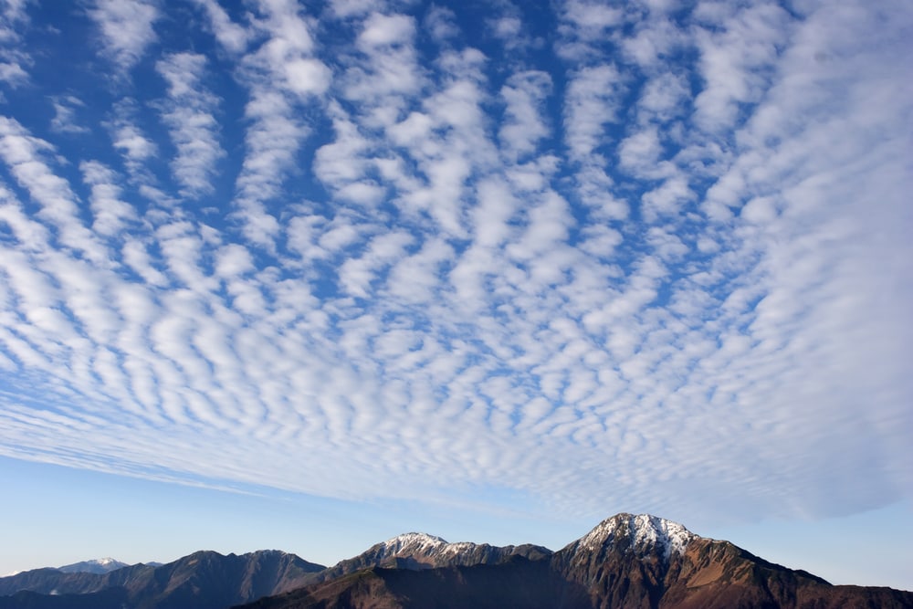 Cirrus clouds on top of a mountain