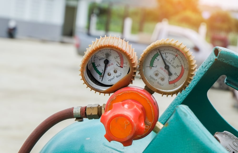 close up of a gas gauge showing the amount of cooking gas available in the tank