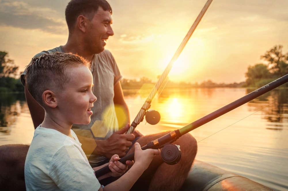 Father and son fishing on a pond