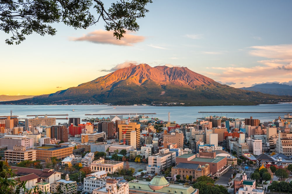 Kagoshima, Japan skyline with Sakurajima Volcano at dusk.