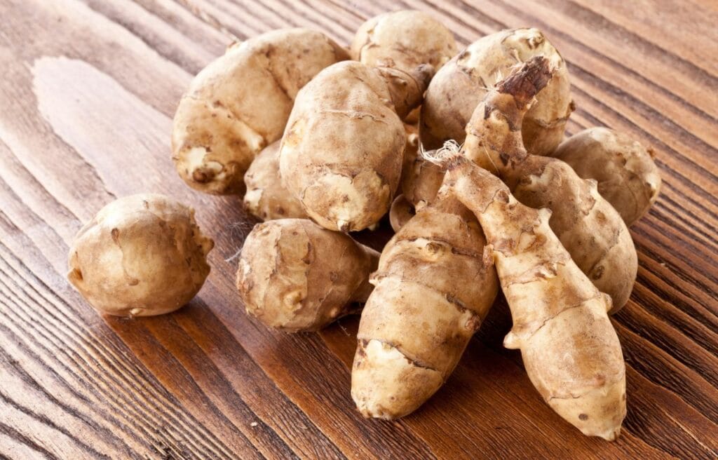 Jerusalem artichokes on a awooden table