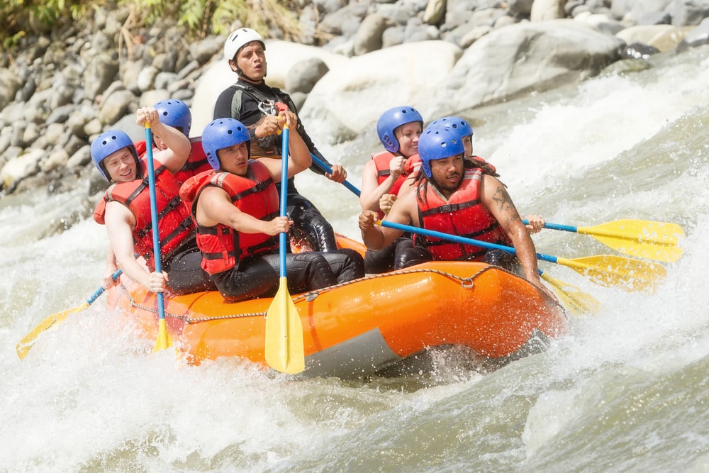 a team enjoying whitewater rafting
