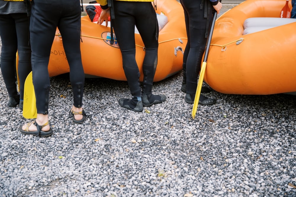 group of rafters preparing to ride the raft